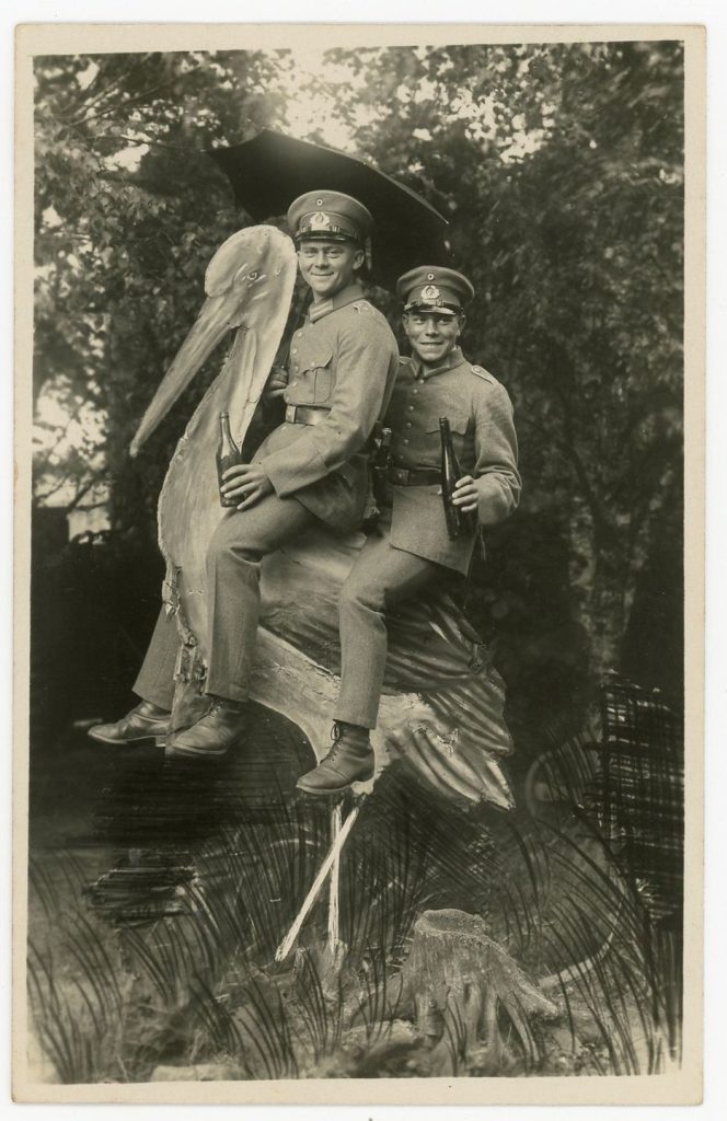 German soldiers on wooden cutout stork.