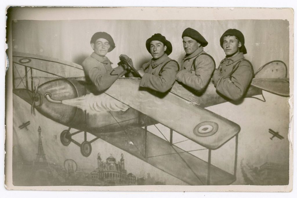 French military aviators in a painted biplane studio prop.